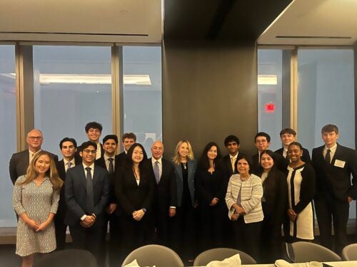 Students with the Psaros family at One Vanderbilt