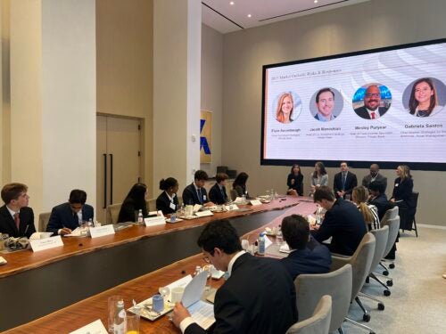 Students in a JPM board room
