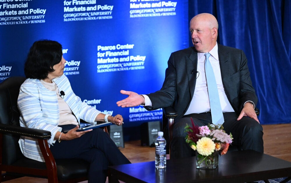 David Solomon speaking to Reena Aggarwal on stage
