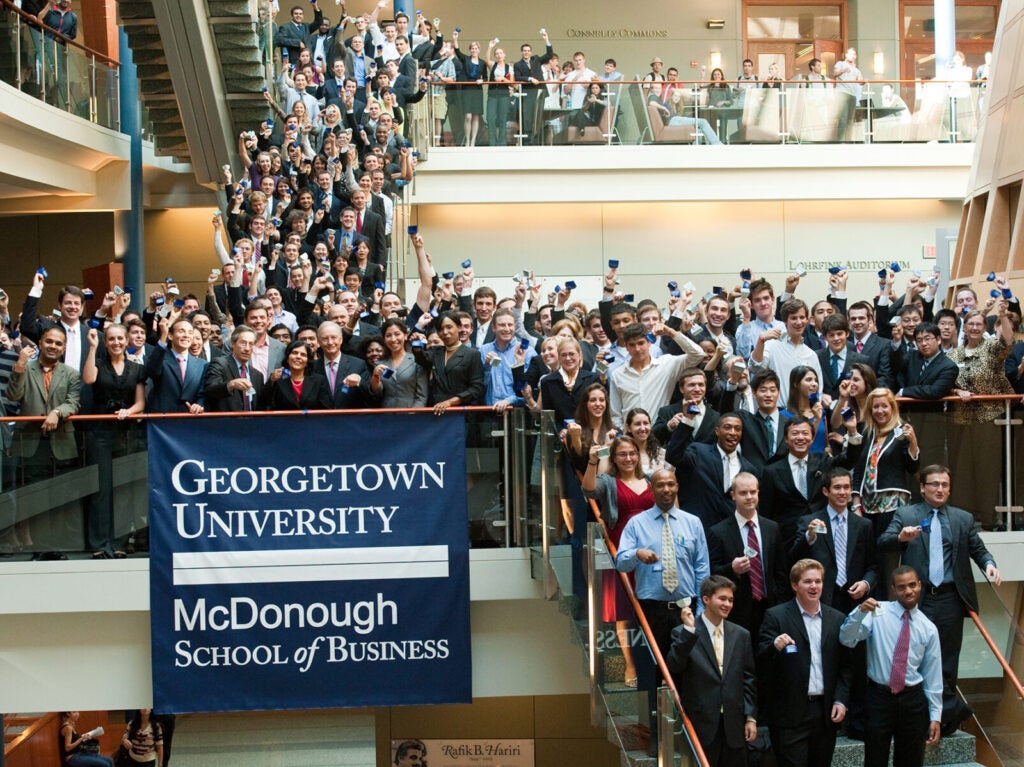 MBA students, faculty and guests at Georgetown University's McDonough School of Business participate in a 
