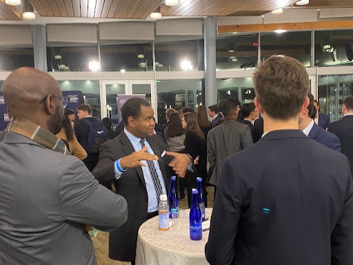 Students talk with guests at networking event