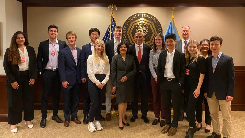 FinPolicy Trek undergraduate student group with Commodity Futures Trading Commission Chair Rostin Behnam